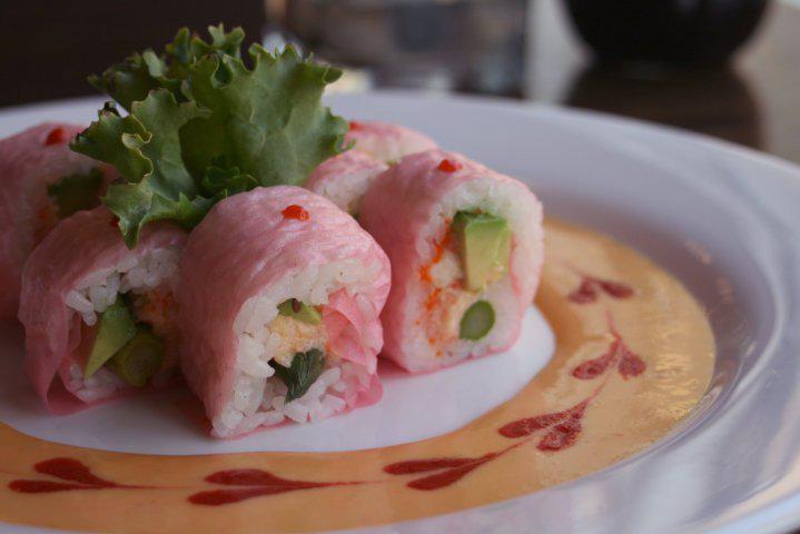 Spicy Mango Lobster Roll · Lobster salad, tobiko, asparagus, avocado, wrapped in soy bean paper, fresh mango sauce, Sriracha sauce.