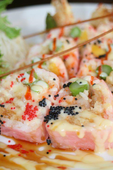 Tokyo Love Story · 2 shrimp tempuras, lobster salad, mango, asparagus, pink soybean sheet, and milk sauce and eel sauce.