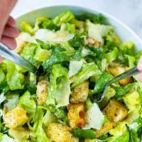 Caesar Salad · Shredded romaine lettuce, topped with Parmesan cheese and croutons.