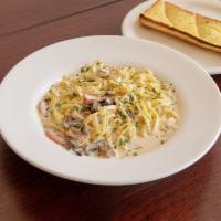 Fettuccine Alfredo · Cream sauce with Parmesan cheese and herbs.