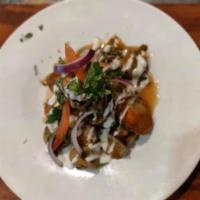 Eggplant Chaat · Crisp eggplant slices drizzled with sweet and sour chutney and fresh cilantro. Vegetarian.