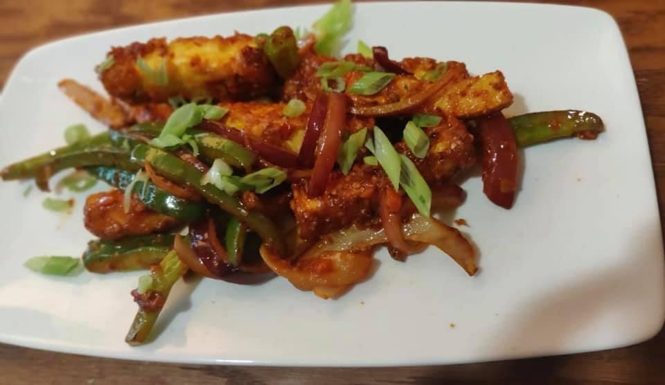 Chili Paneer · Homemade Indian cheese pan-fried and tossed in spicy chili sauce. Vegetarian.