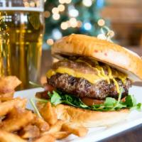 British Beer Burger · Angus steak burger topped with cheddar cheese, brewpub mustard, bacon jam, lettuce and tomat...