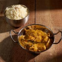 Chicken Shai Korma Curry · Tender chicken delicately cooked in a rich sauce of nuts and cream.
