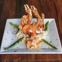 Cangrejo  Aleluya · Flash fried soft shell crab, stuffed with crawfish and shrimp topped with a lobster sauce.