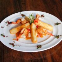 Camarones al Ajillo · Jumbo shrimp with Latin infused citrus garlic served over whipped cauliflower.