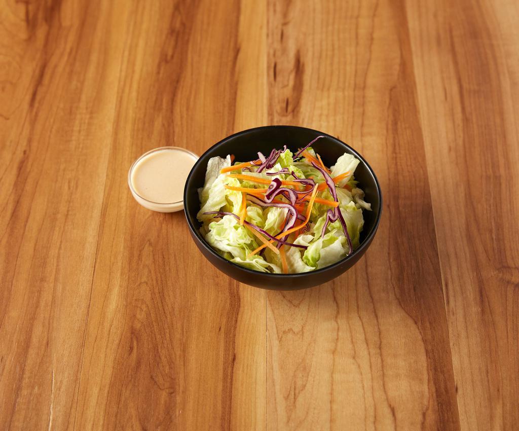 House Salad · House vegetables served with ginger dressing.
