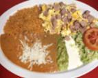 Ham and Eggs · Ham and eggs served with rice, re-fried beans, lettuce, guacamole, cheese, sour cream, and c...