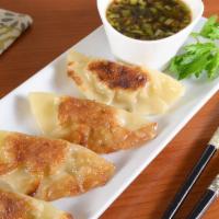 A10. Pot Stickers (6pcs) · Pork dumplings with a choice of Steamed or Fried. Served with teriyaki sauce.