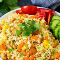F01. Thai Fried Rice · Thai fried rice with peas & carrots and your choice of proteins. Stir-fried with tomatoes, g...