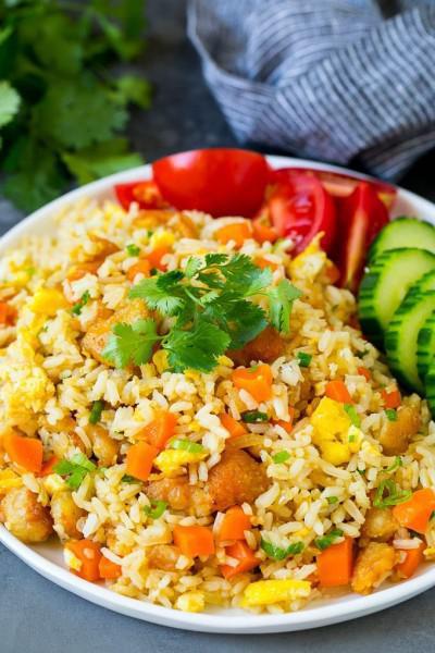 F01. Thai Fried Rice · Thai fried rice with peas & carrots and your choice of proteins. Stir-fried with tomatoes, green onion, onion, and eggs.