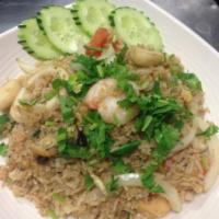 F04. Thai Seafood Fried Rice · Thai fried rice with peas & carrots, a combination of mussel, fish ball, squid, and shrimp. ...