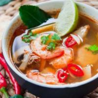 SE4. Tom Yum Seafood Soup · Thai hot and sour flavored with lemongrass, lime leaf, lime juice, chili paste, mushroom, to...