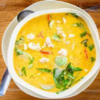 E02. Yellow Curry · Flavored with yellow curry, Thai chili pasted, a choice of meat, with coconut milk, bamboo, ...