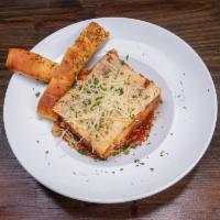 Lasagna Bolognese · Hand stuffed fresh pasta with all Angus beef meat sauce and topped with mozzarella cheese. S...