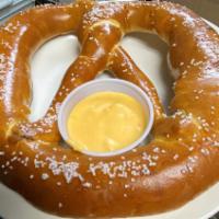 Docks Pretzel · Giant hand rolled & salted twisted pretzel served with our homemade beer cheese sauce.