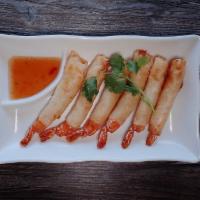 Crispy Shrimp Roll · Fried marinated shrimp wrapped. Serve with sweet and sour sauce.