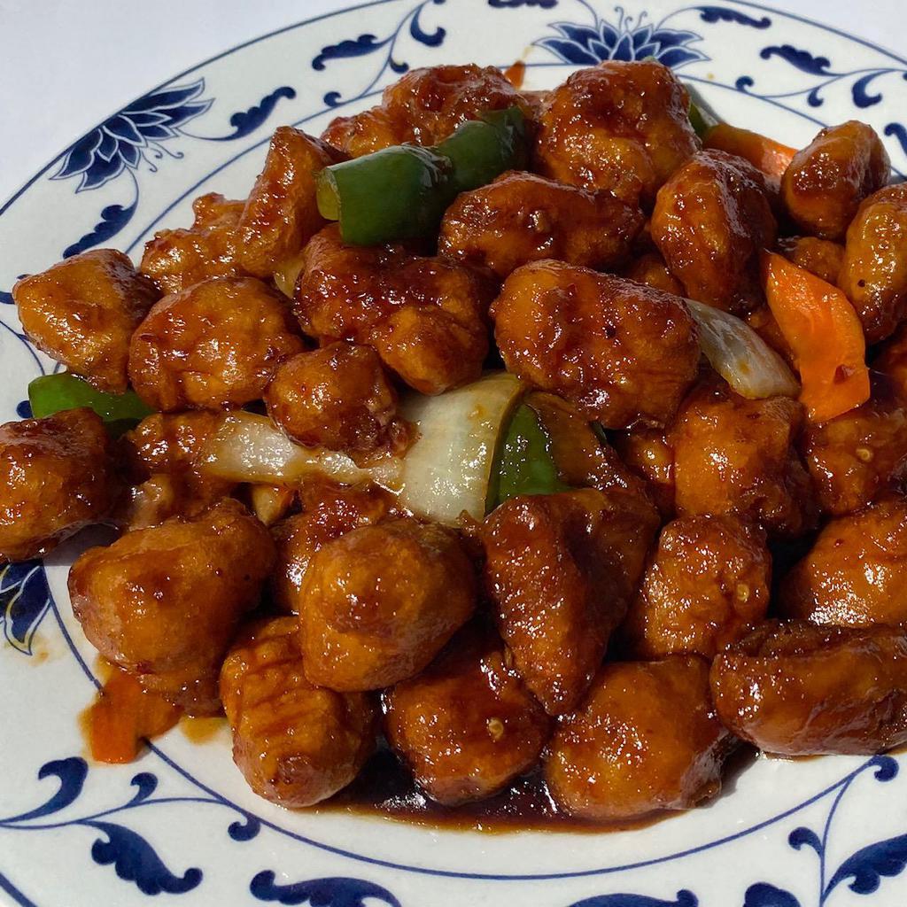 Honey Chicken · Deep-fried crispy chicken cooked with white onions and carrots in a honey glazed sauce. Hot and spicy.