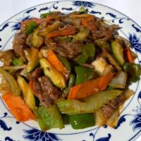 Hunan Beef · Sliced beef cooked with white onions, mushrooms, zucchini, bell peppers, water chestnuts, ca...
