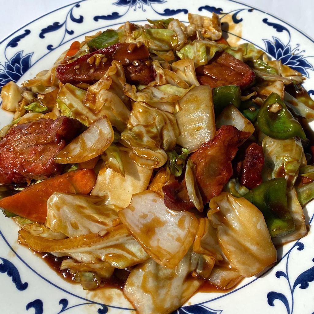 Twice Cooked Pork · BBQ pork cooked with cabbage, carrots, white onions, and bell peppers in a spicy Szechuan sauce. Hot and spicy.