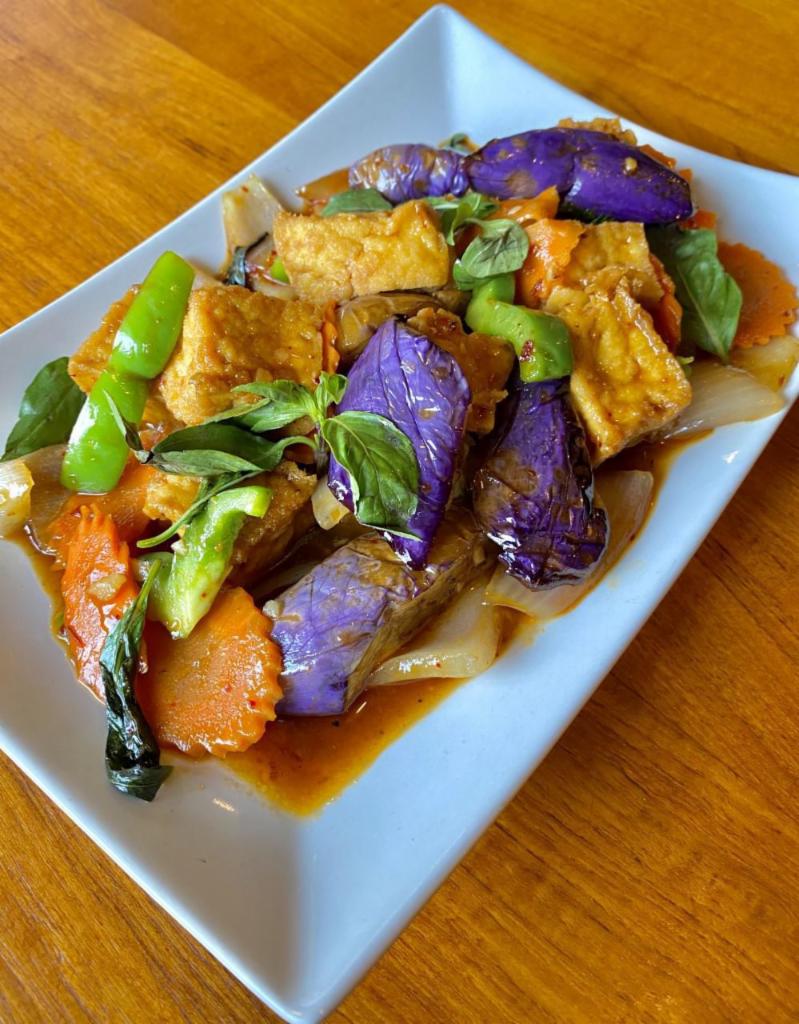 Spicy Eggplant with Tofu · Asian eggplant stir-fried with fried tofu, basil, bell peppers, onions, and carrots, in our bean paste sauce and chili powder. Served with steamed rice. Spicy.