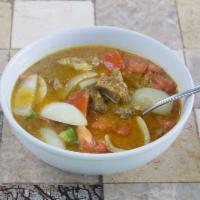 Goat Kikil · Soup of bone-in pieces of goat meat cooked in a turmeric based sauce with onions, jalapeno p...