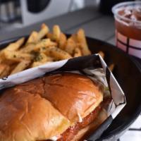 PONKO Chicken Sandwich + Side · Topped with slaw.