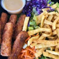 Tofu Tenders Salad · 6 pcs of tofu on the side. Chopped romaine lettuce, carrots, and red cabbage, wontons & choi...