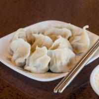 Handmade Dumpling 水饺 · Fillings made with ground pork and chives.