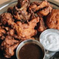 Pakora Appetizer (GF) · Pickled, Battered and Deep fried with Tamarind chutney and Coconut Yogurt