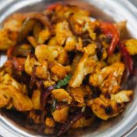 Roasted Cauliflower (GF) · Roasted cauliflower with sautéed onions and bell peppers, tossed in a Indo-Chinese sweet and...