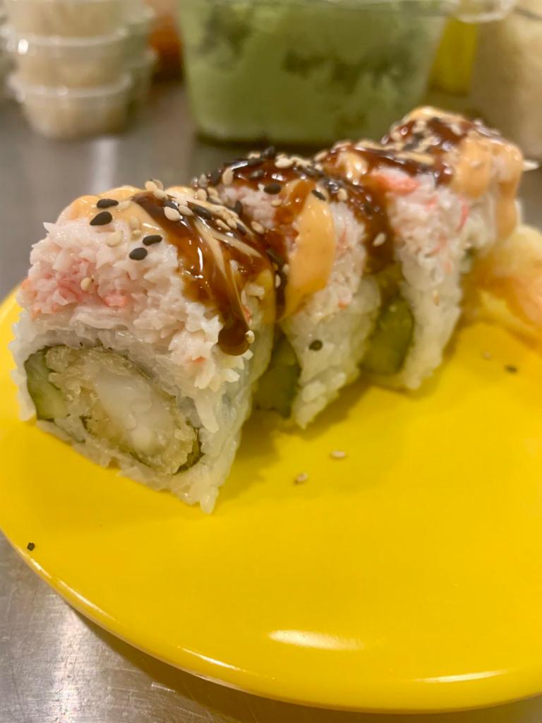 Tiger Roll · Inside: Tempura shrimp, cucumber. Top: crab salad, sesame seed, spicy mayo and eel sauce.