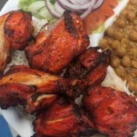9. Bone in Chicken Kabob · 6 pieces of  grilled chicken dark meat, marinated in house spices. Served with basmati rice,...