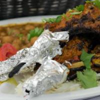 12. Lamb Chops · 3 pieces of Grilled tender lamb chops,  marinated in house spices. Served with basmati rice,...