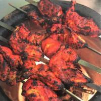 Tandoori (Oven) Grilled Chicken - Full Size · Chicken marinated in yogurt, ginger and house spices. Grille in Tandoor (Mud Oven). serve wi...