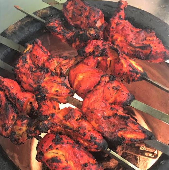 Tandoori (Oven) Grilled Chicken - Full Size · Chicken marinated in yogurt, ginger and house spices. Grille in Tandoor (Mud Oven). serve with white basmati rice, two side chickpeas, two naan bread, salad and sauces