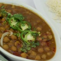20. Chana Masala · Garbanzo beans cooked with onions, tomatoes and house spices. Served with basmati rice. Vege...