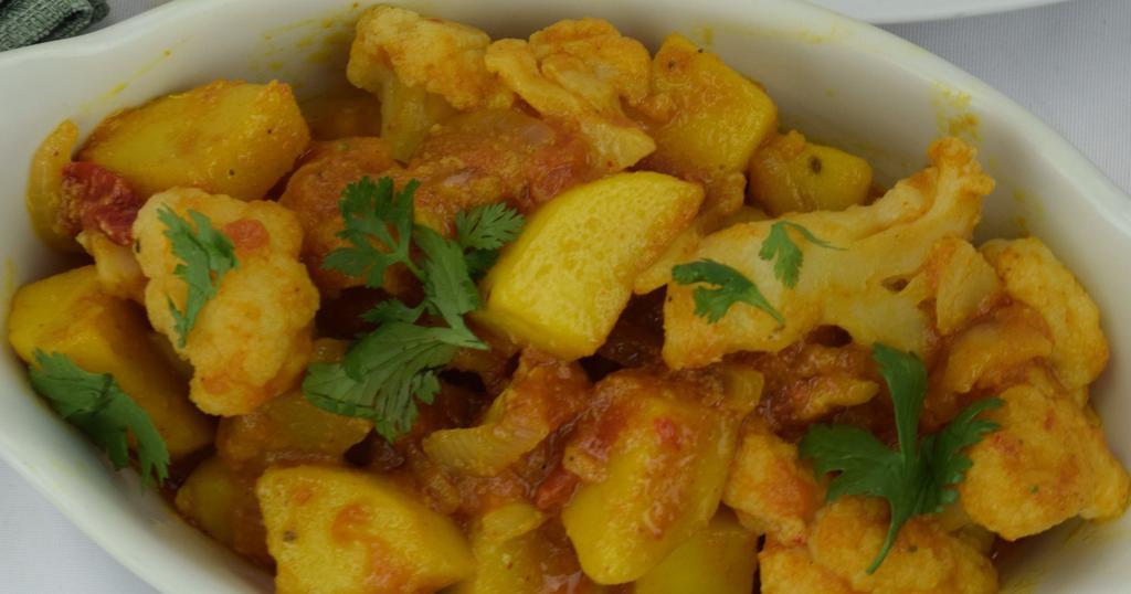 21. Aloo Gobi Masala · Fresh cauliflower and potatoes sauteed with tomatoes, onions and house spices. Served with basmati rice. Vegetarian.