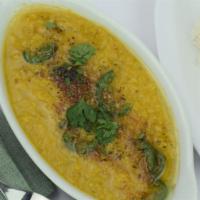 26. Yellow Daal · Lentils cooked in house spices. Served with basmati rice. Vegetarian.