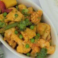 35. Chicken Jalfrezi · Chicken cooked with fresh mixed vegetables and house spices. Served with basmati rice.