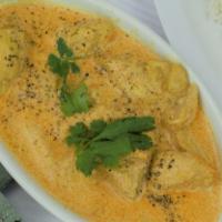 36. Chicken Korma · Chicken cooked with creamy sauce, dried nuts and house spices. Served with basmati rice.