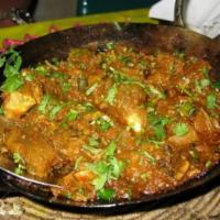 38. Chicken Karahi for 2 · Chicken cooked with fresh ginger, cilantro, diced tomatoes and  house spices. Served with Se...