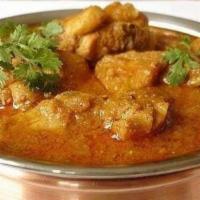 42. Lamb Curry · Lamb cooked in house curry sauce and spices. Served with basmati rice.