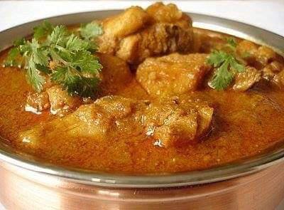 42. Lamb Curry · Lamb cooked in house curry sauce and spices. Served with basmati rice.