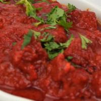 46. Lamb Rogangosh · Lamb cooked with fresh ginger, garlic, tomatoes and house spices. Served with basmati rice.