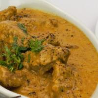 48. Lamb Korma · Lamb cooked with creamy sauce, dried nuts and house spices. Served with basmati rice.