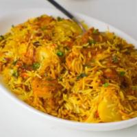 53. Chicken Biryani · Tender chicken cooked with basmati rice. Served with raita.