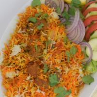 54. Lamb Biryani · Lamb cooked with basmati rice. Served with salad and  raita.