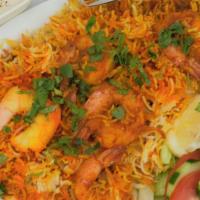 55. Shrimp Biryani · Large prawns cooked with basmati rice. Served with salad and  raita.