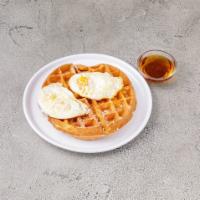 Waffle Egg'o · Bacon infused waffle, 2 fried eggs, maple syrup and powdered sugar.